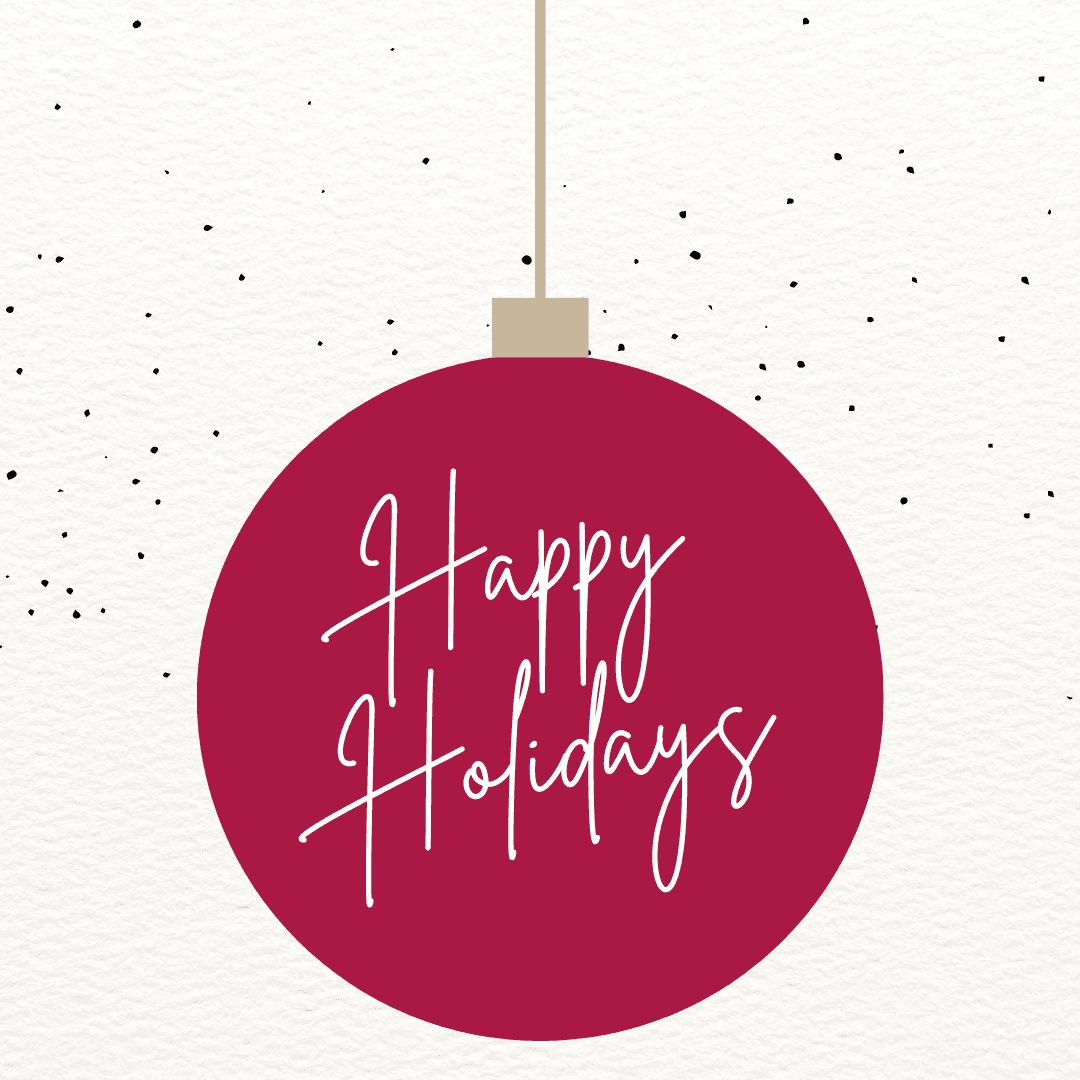 happy holidays text on red ornment on textured white background with gray dots sprinkled on top half