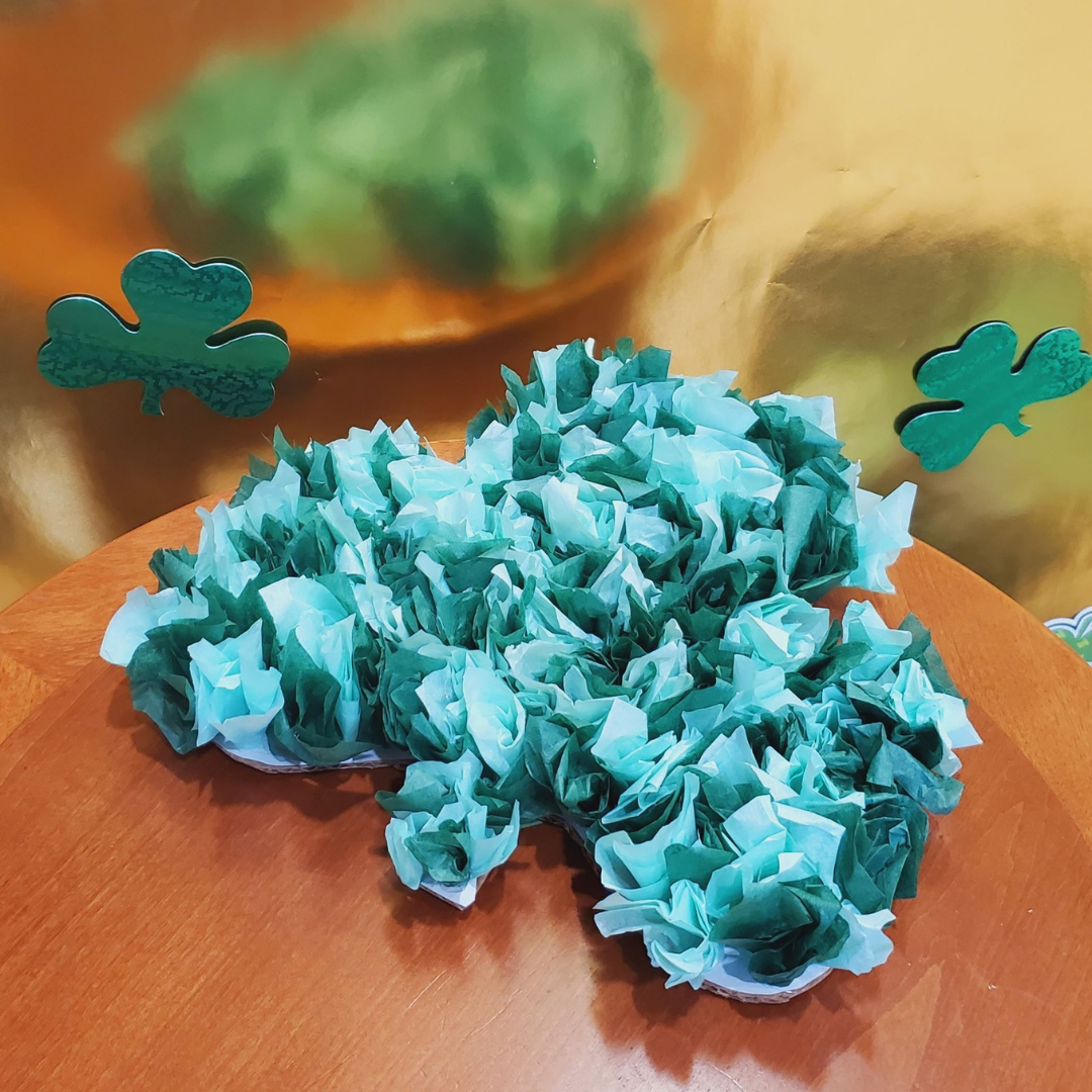 craft shamrock made using tissue paper in varying shades of green