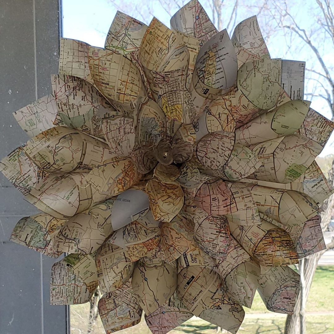map flower made of cut atlas map paper