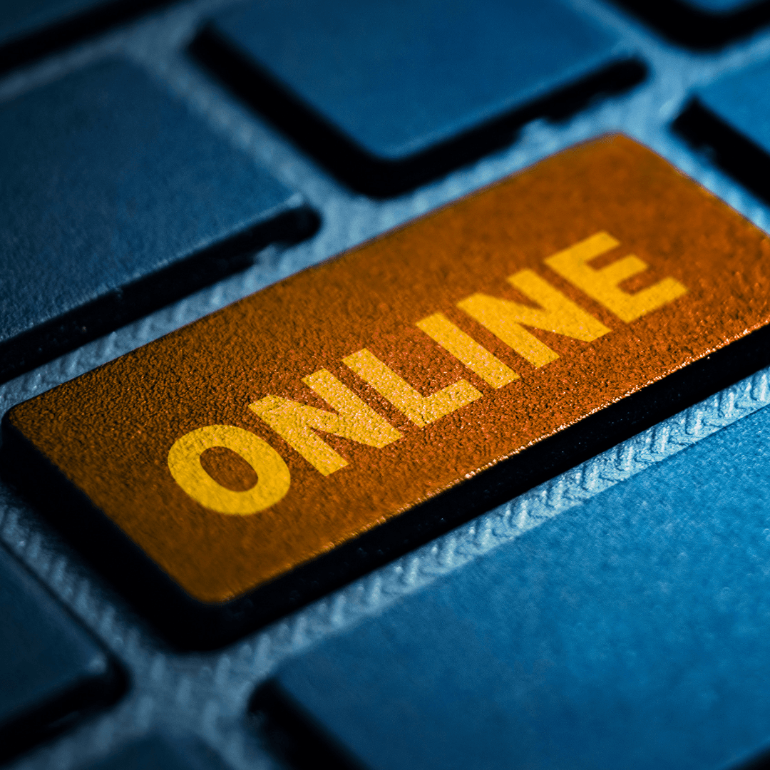 keyboard with a wooden looking button that has text: online on it 