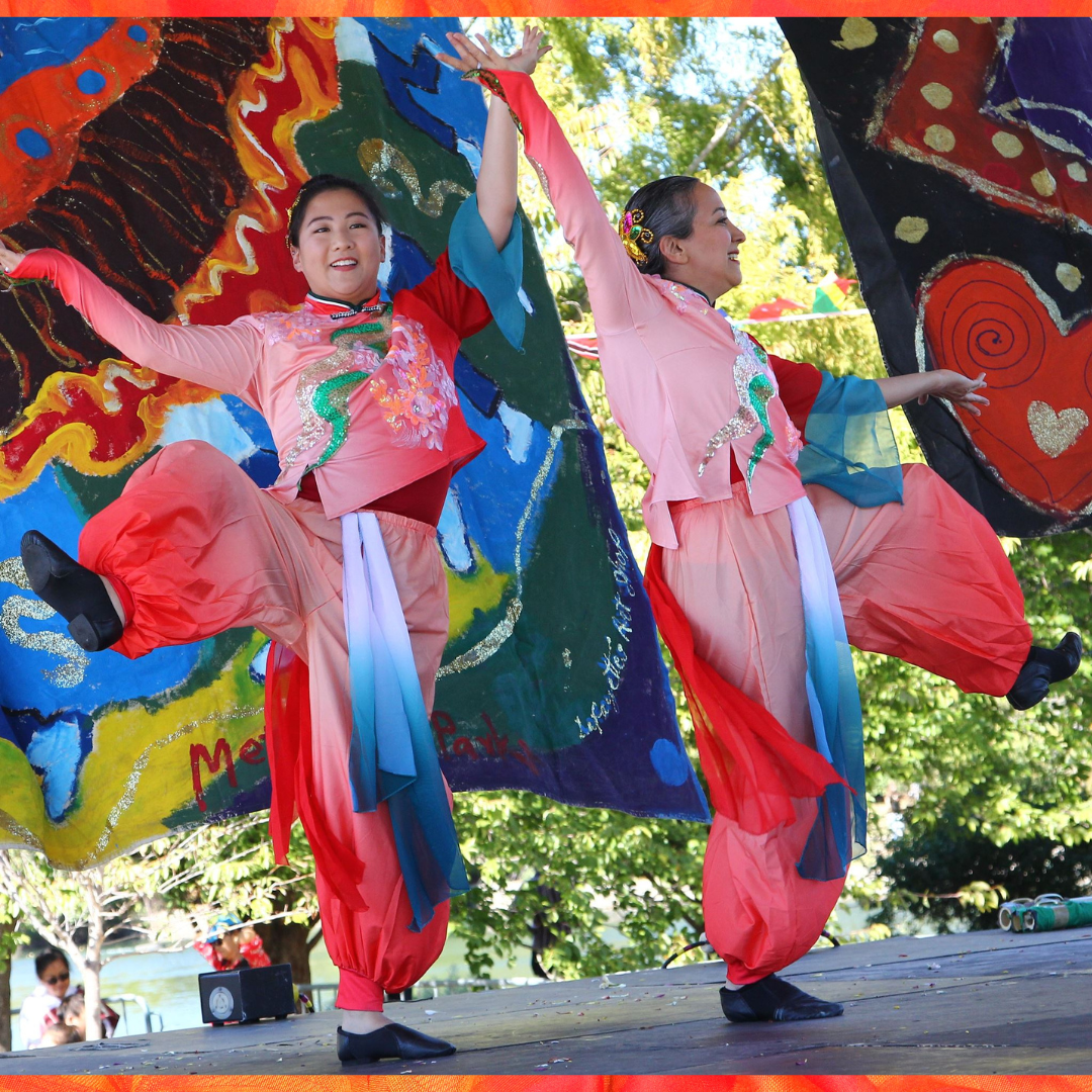 photo of Chinese dancers with flags 