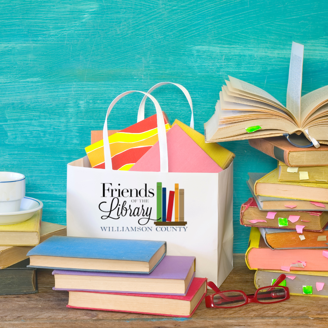 Bag with Friends of the Library logo on stack of books and books inside it. More books piled nearby