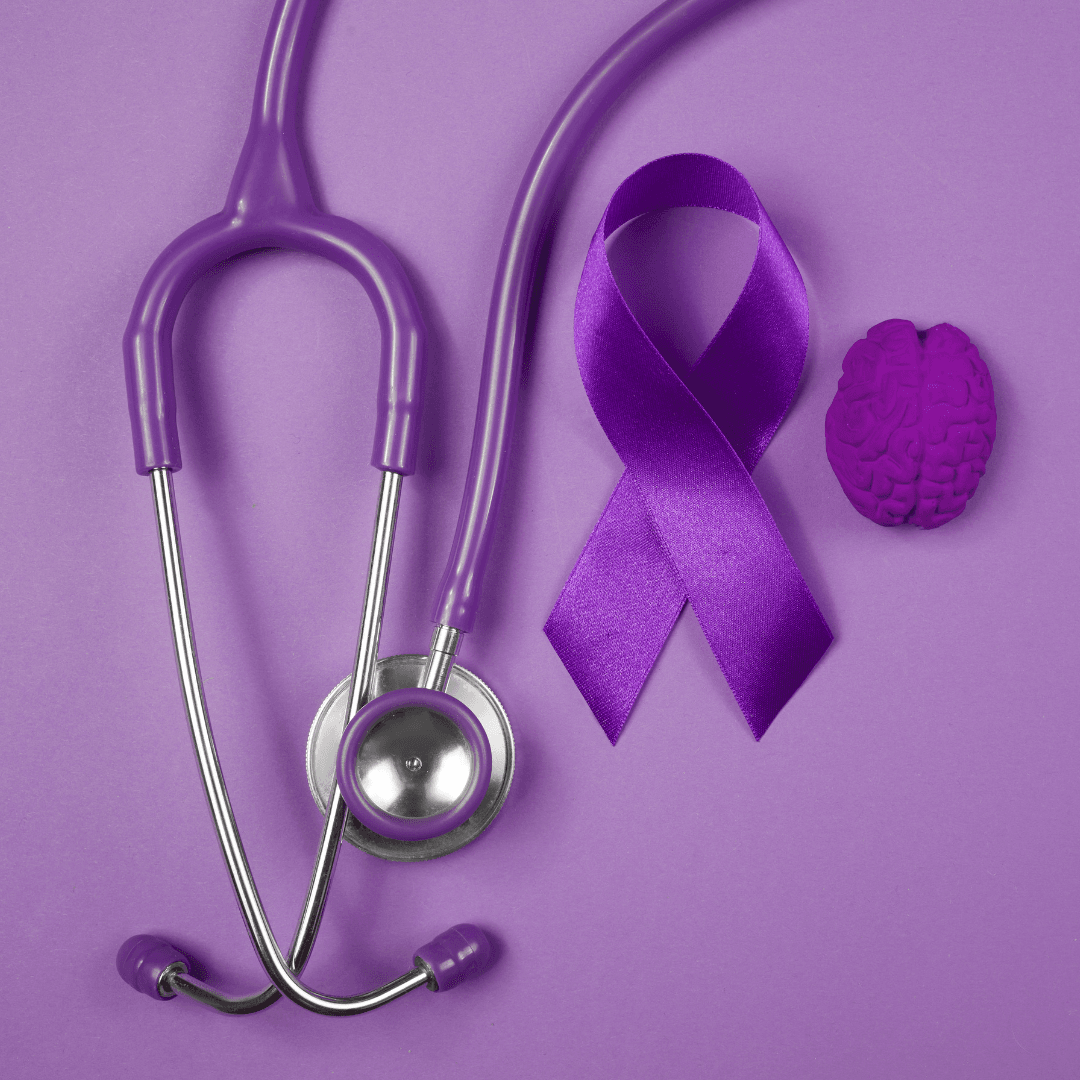 purple ribbon for alzheimers with a purple stethoscope and purple brain