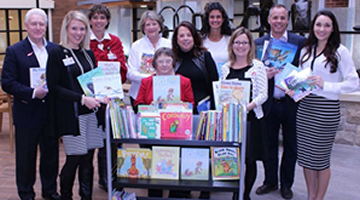 The foundation with a cart full of childrens books