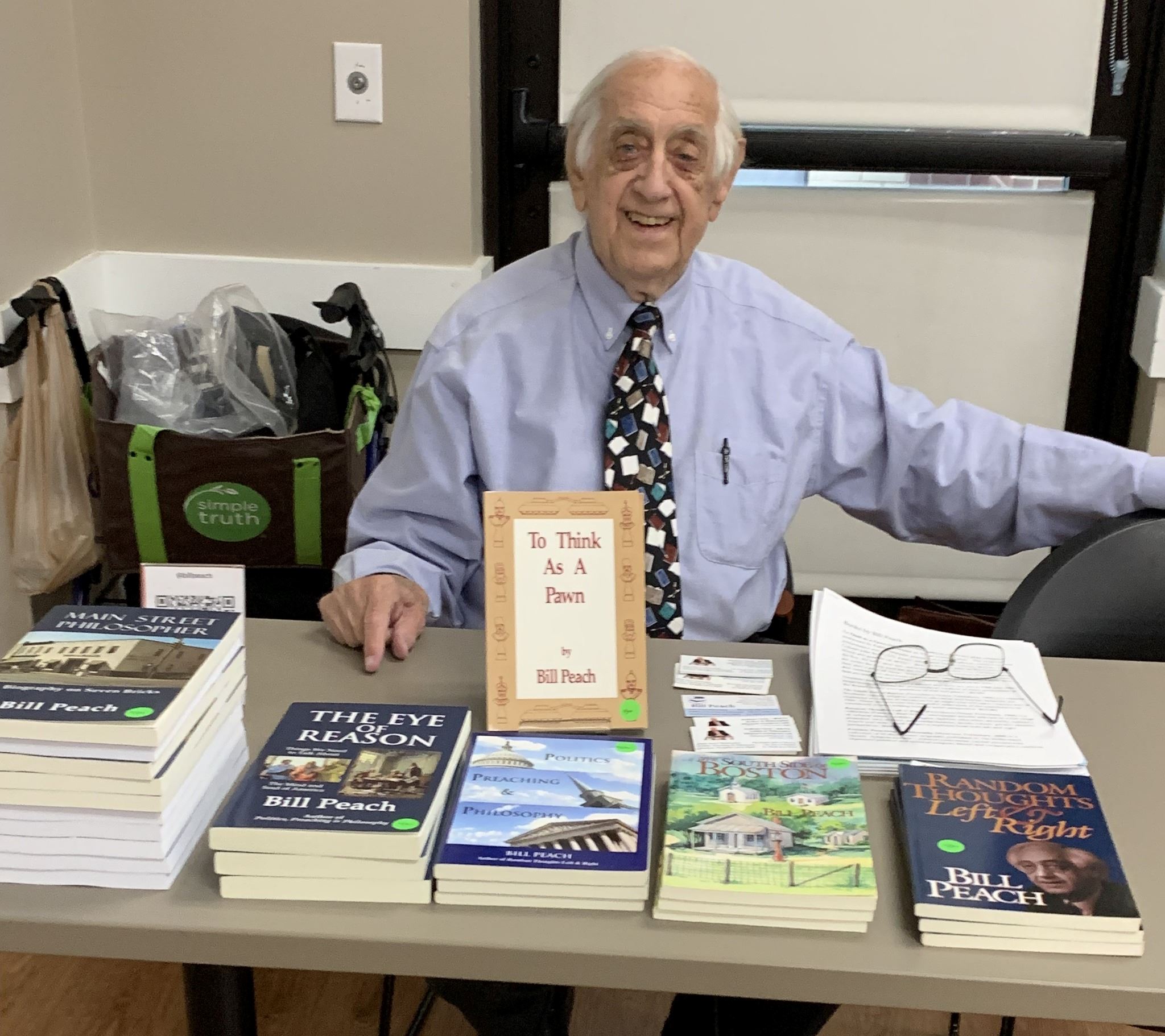 Photo of Bill Peach with his books at the Franklin Book Festival