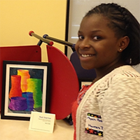 Student with painting of vases
