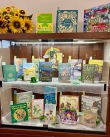 friends book sale display case photo decorated for St Patrick's Day with themed books